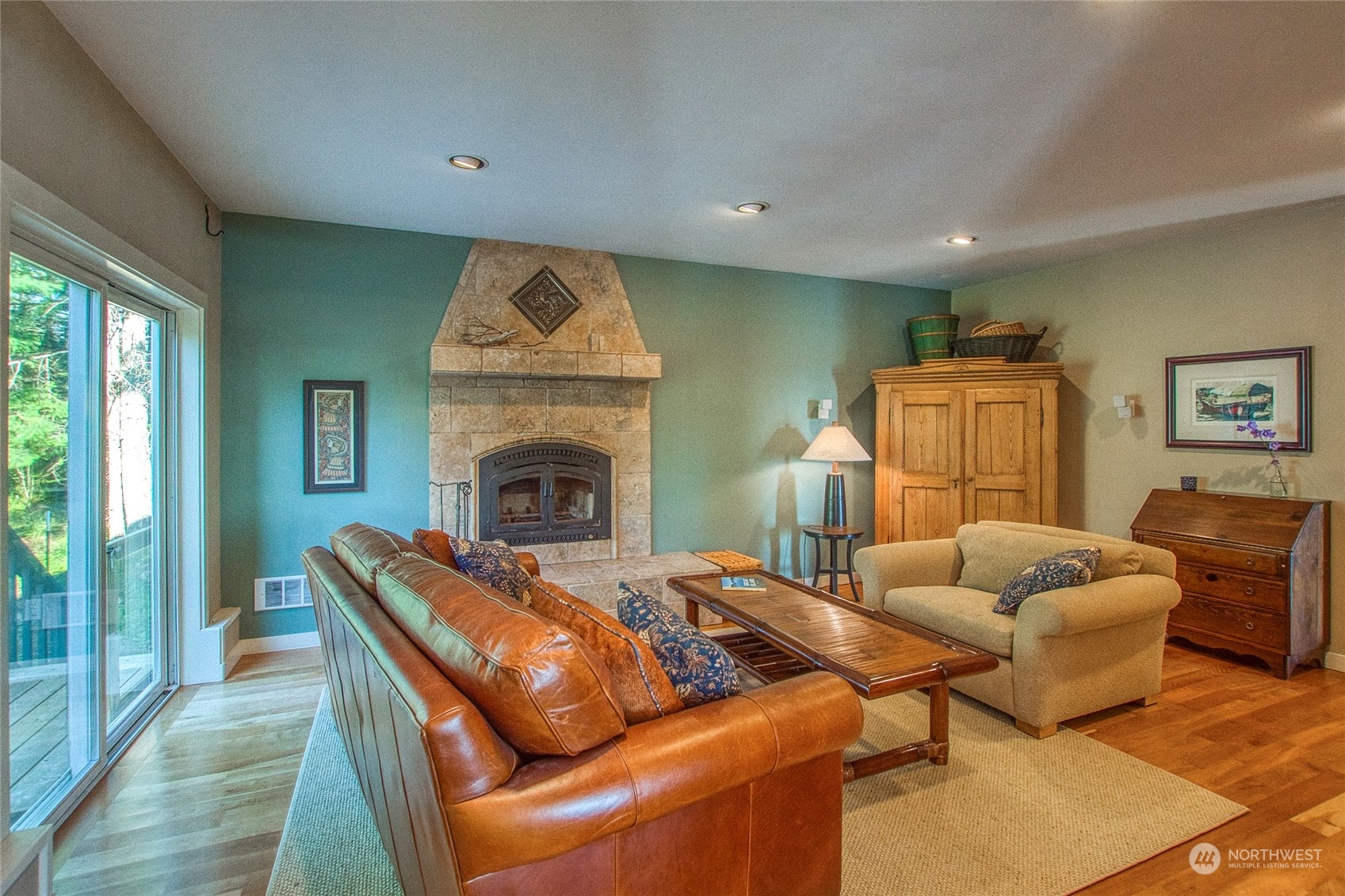 381 Geiser Way Orcas Island, WA 98245 - Photo 13 of 40 a living room with furniture and a fireplace