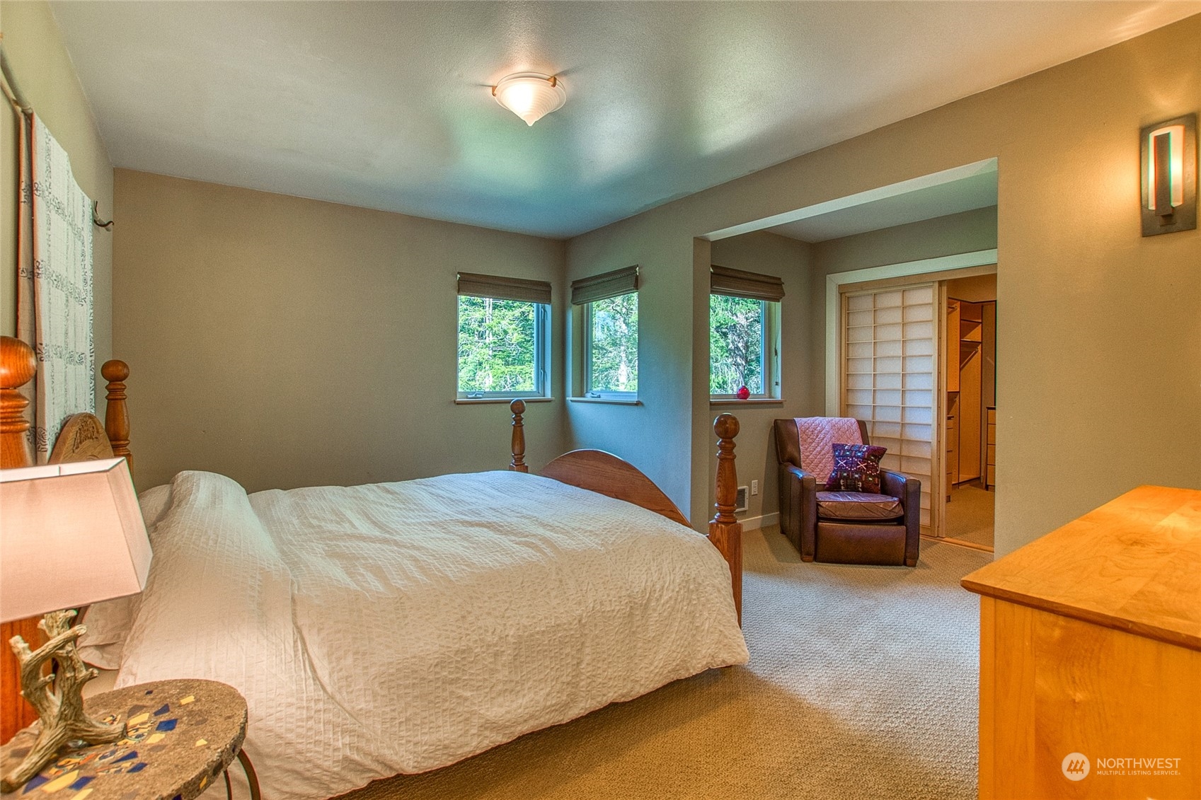 381 Geiser Way Orcas Island, WA 98245 - Photo 15 of 40 a bedroom with a bed and wooden floor