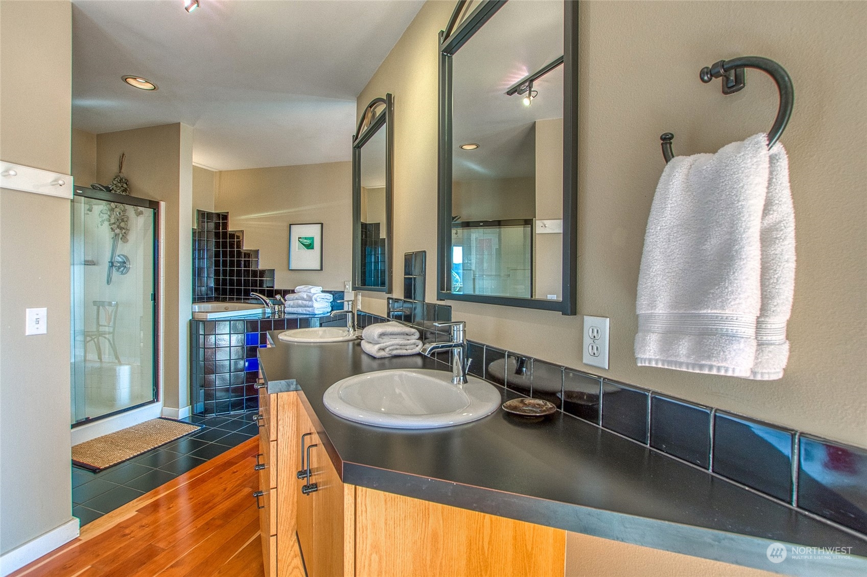 381 Geiser Way Orcas Island, WA 98245 - Photo 17 of 40 a bathroom with a tub sink and mirror