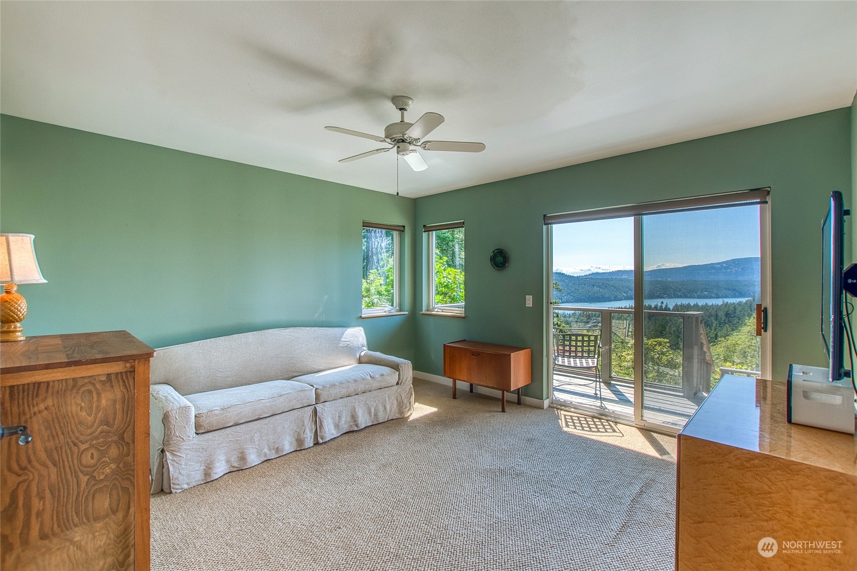 381 Geiser Way Orcas Island, WA 98245 - Photo 23 of 40 a living room with furniture and a window
