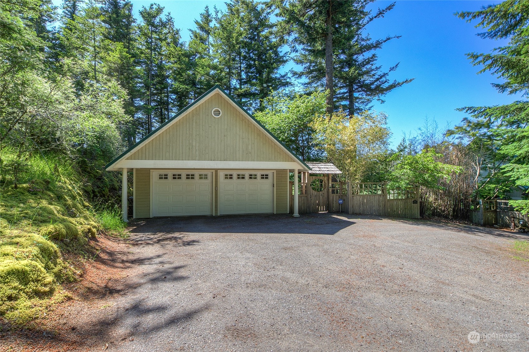 381 Geiser Way Orcas Island, WA 98245 - Photo 31 of 40 a view of a house with a yard and large trees