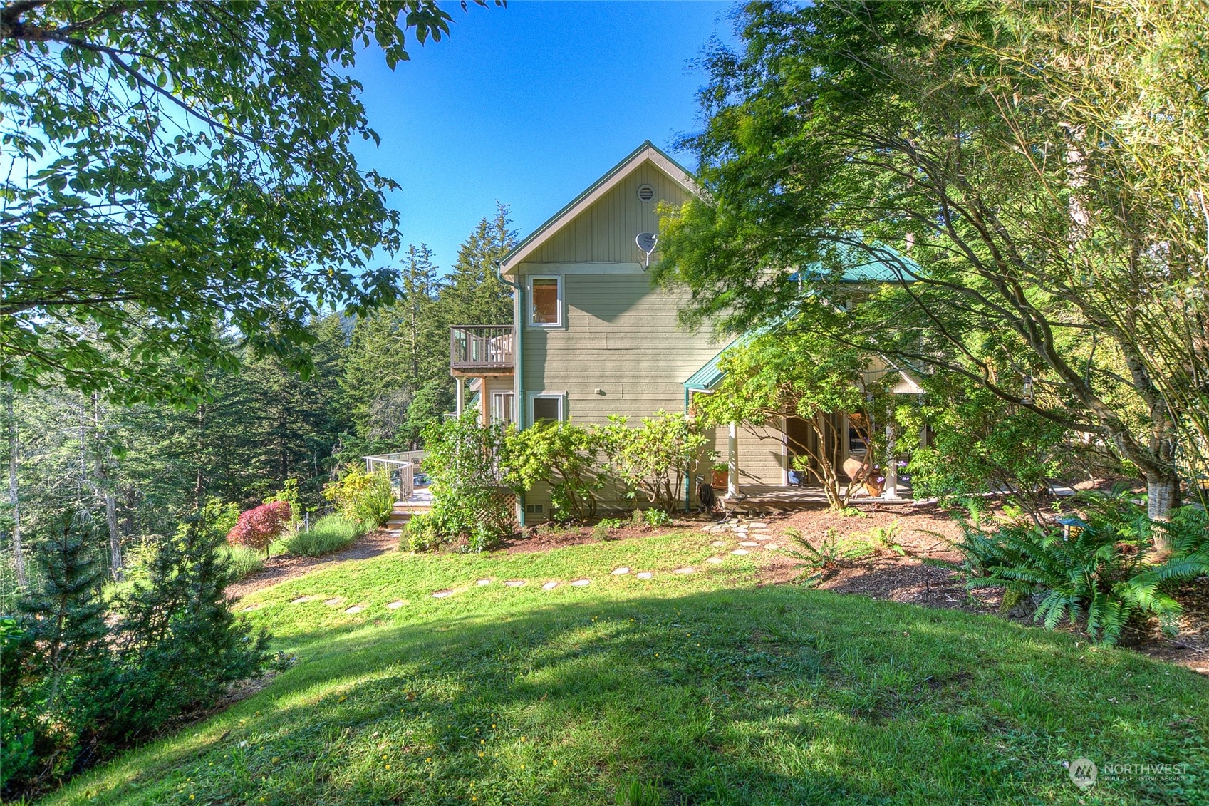 381 Geiser Way Orcas Island, WA 98245 - Photo 34 of 40 a view of a backyard with plants and large trees