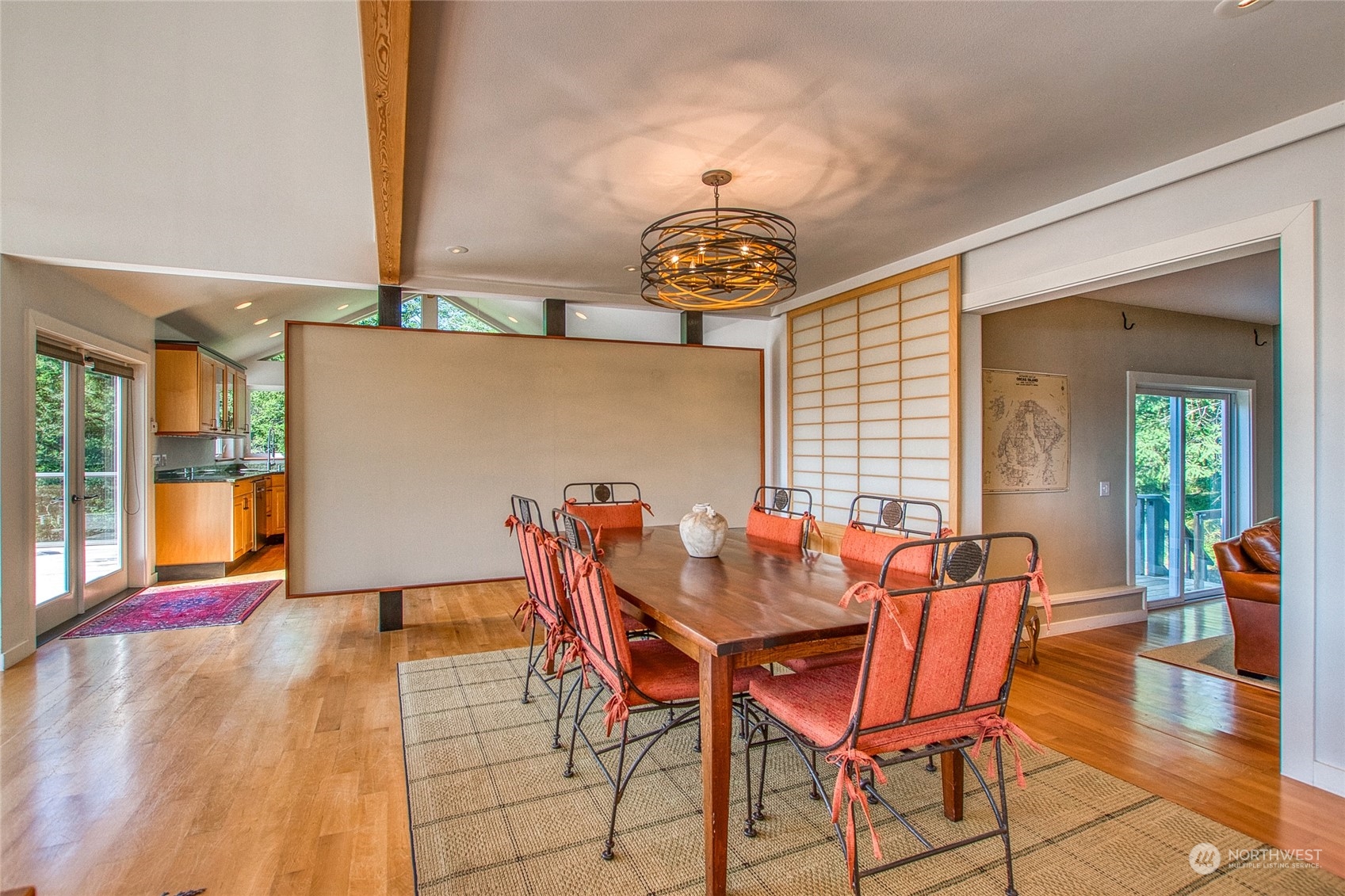 381 Geiser Way Orcas Island, WA 98245 - Photo 9 of 40 a dining room with furniture and wooden floor