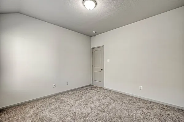 a bathroom with a sink a toilet a mirror and bathtub