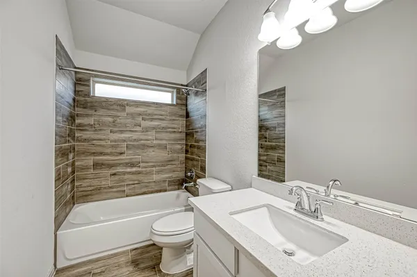 a view of a livingroom with a ceiling fan and window
