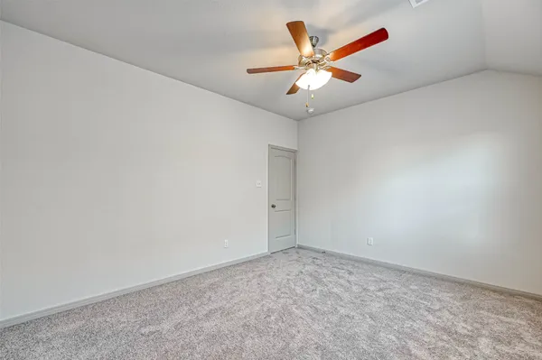 a bathroom with a sink a toilet a mirror and shower