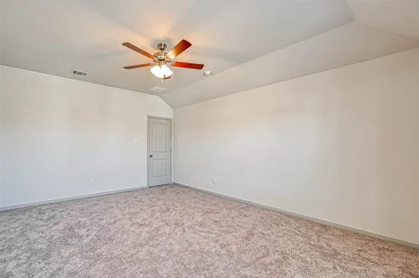 a bathroom with a toilet a sink a tub and a mirror