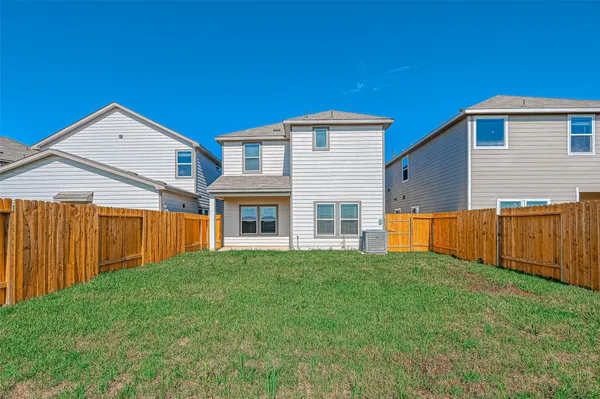 a view of yard with wooden fence