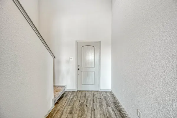 a view of front door with wooden floor