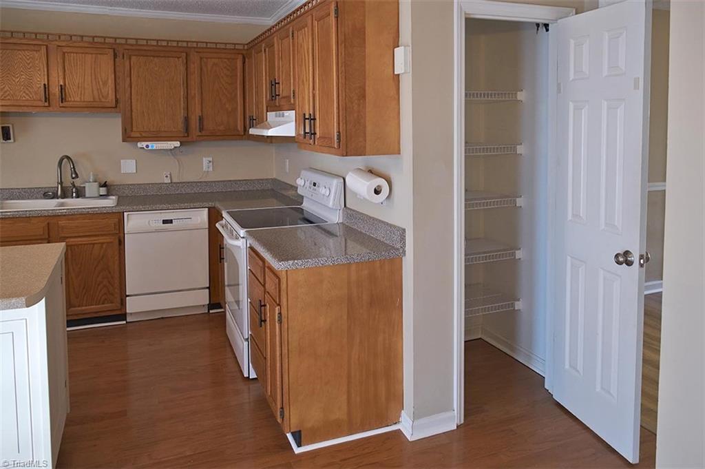 1012 Springwood Lane Archdale, NC 27370 - Photo 12 of 46 Pantry in the kitchen. Built in dishwasher and new garbage disposal.