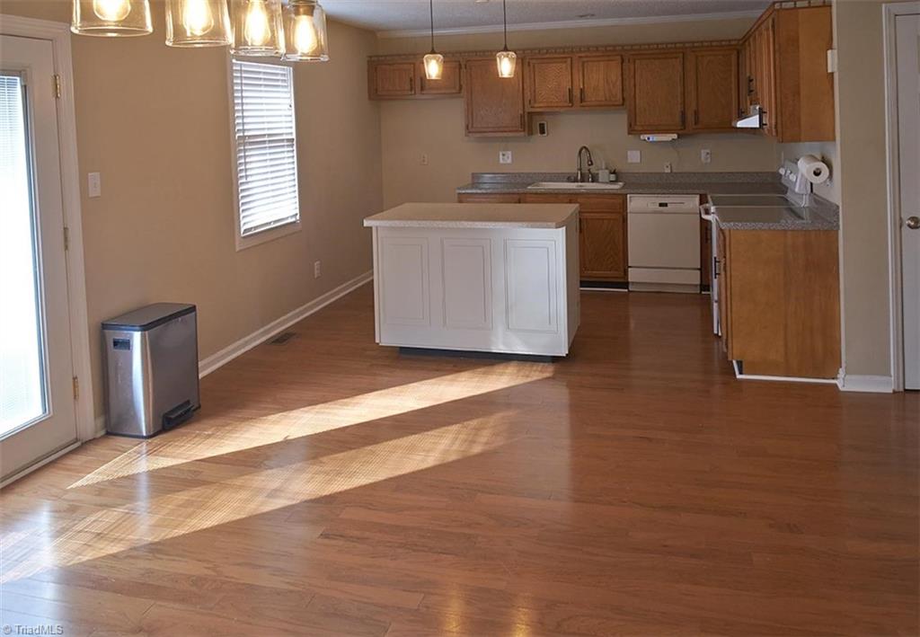 1012 Springwood Lane Archdale, NC 27370 - Photo 14 of 46 Bright and spacious! Updated lighting in kitchen and dining room. Faux wood venetian blinds throughout the kitchen, DR, Living room and bedrooms.