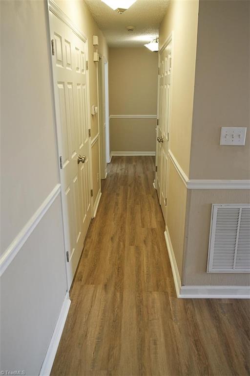 1012 Springwood Lane Archdale, NC 27370 - Photo 20 of 46 Hallway to bedrooms. Washer & Dryer connections in left closet, and a large double storage closet on the right.