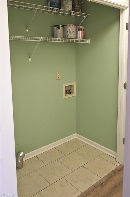 1012 Springwood Lane Archdale, NC 27370 - Photo 21 of 46 Laundry closet with tile floors and storage.