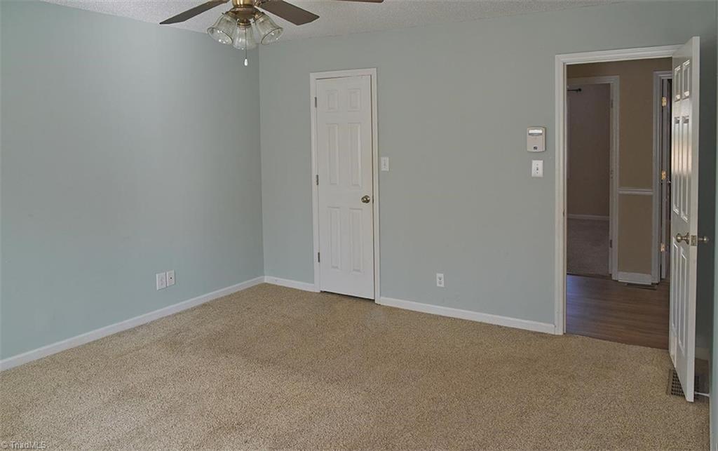 1012 Springwood Lane Archdale, NC 27370 - Photo 25 of 46 Primary bedroom walk in closet.