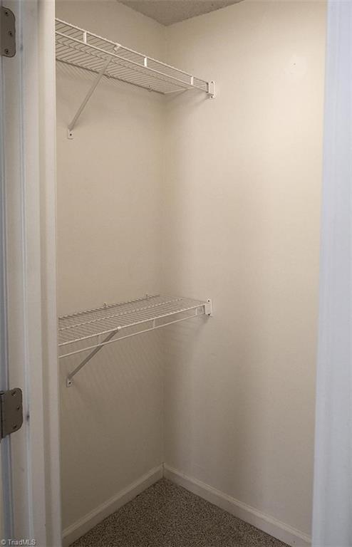 1012 Springwood Lane Archdale, NC 27370 - Photo 26 of 46 Primary bedroom walk in closet.