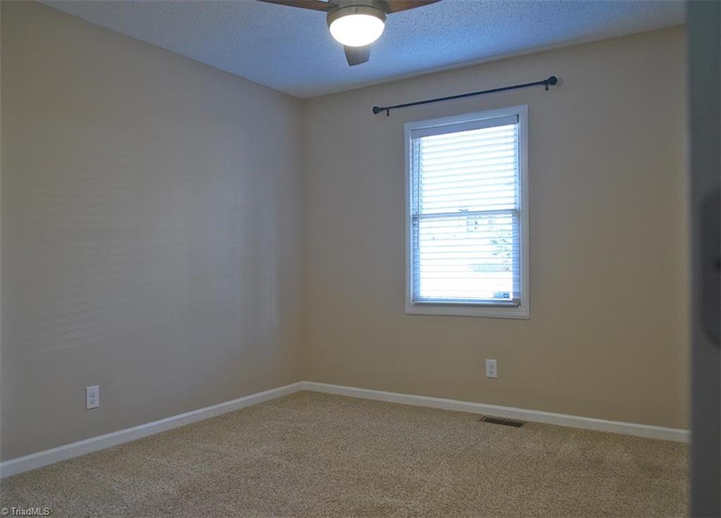1012 Springwood Lane Archdale, NC 27370 - Photo 29 of 46 Bedroom 2 has faux wood venetian blinds.