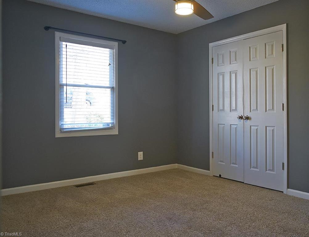 1012 Springwood Lane Archdale, NC 27370 - Photo 32 of 46 Bedroom 3 has faux wood venetian blinds.
