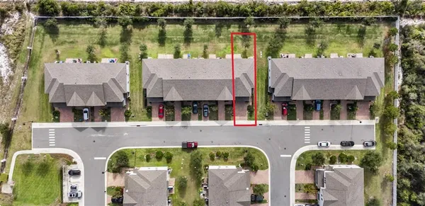 a aerial view of a house with a lake view
