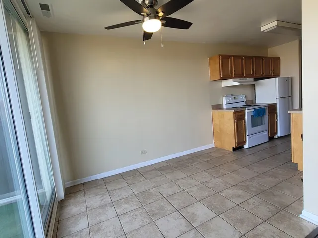 a kitchen with a sink and a stove top oven