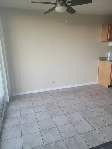 a view of a livingroom with an empty space and a sink