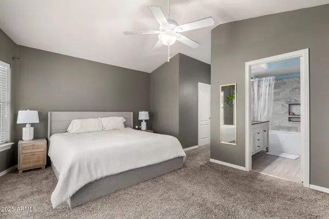 a bedroom with a bed and a view of bathroom