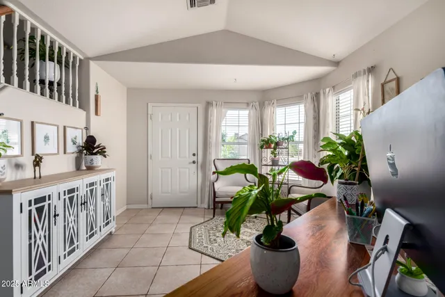 a lobby with furniture and floor to ceiling window