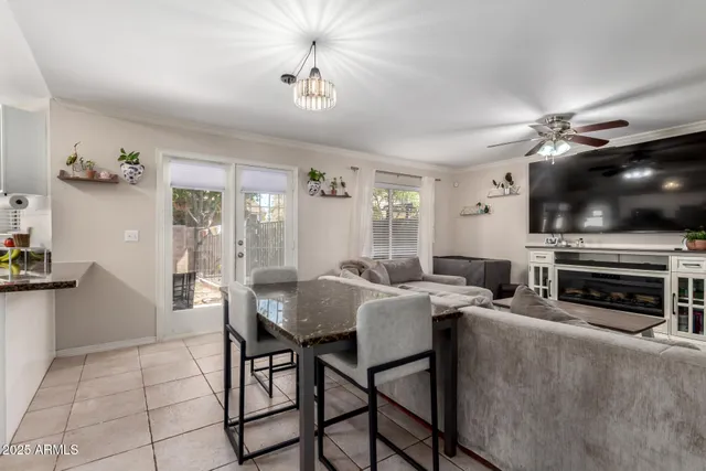 a view of a livingroom with furniture and a flat screen tv