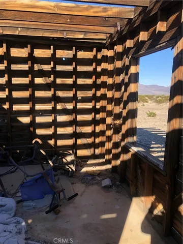 a view of an empty room and a window