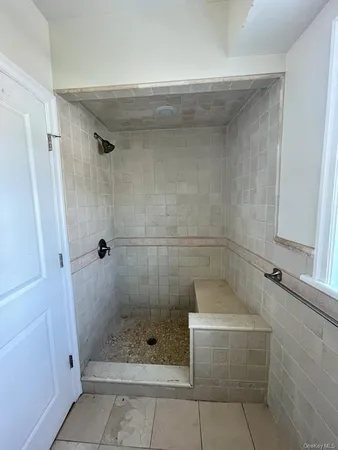 a bathroom with a shower and a bathtub