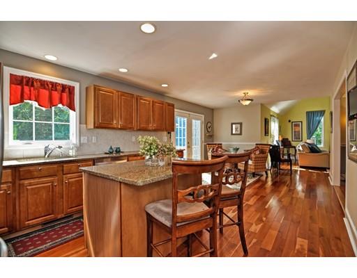 3 Francis Farm Road Rehoboth, MA 02769 - Photo 11 of 30 a open kitchen with stainless steel appliances granite countertop a refrigerator a sink dishwasher a dining table and chairs with wooden floor