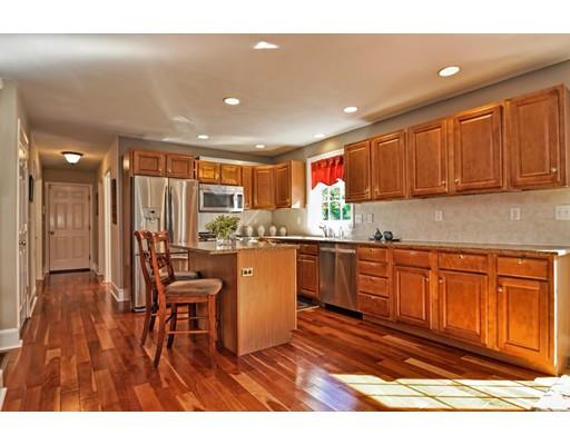 3 Francis Farm Road Rehoboth, MA 02769 - Photo 12 of 30 a kitchen with stainless steel appliances granite countertop a refrigerator a sink dishwasher a stove with wooden cabinets and wooden floor