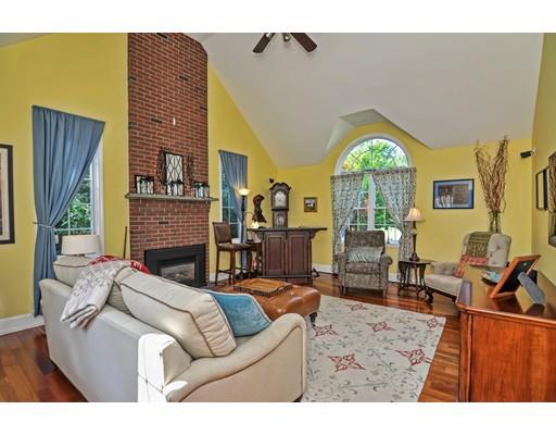 3 Francis Farm Road Rehoboth, MA 02769 - Photo 17 of 30 a living room with furniture a fireplace and a large window