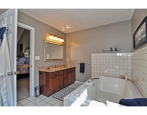3 Francis Farm Road Rehoboth, MA 02769 - Photo 29 of 30 a bathroom with a tub a double vanity sink a mirror and a shower