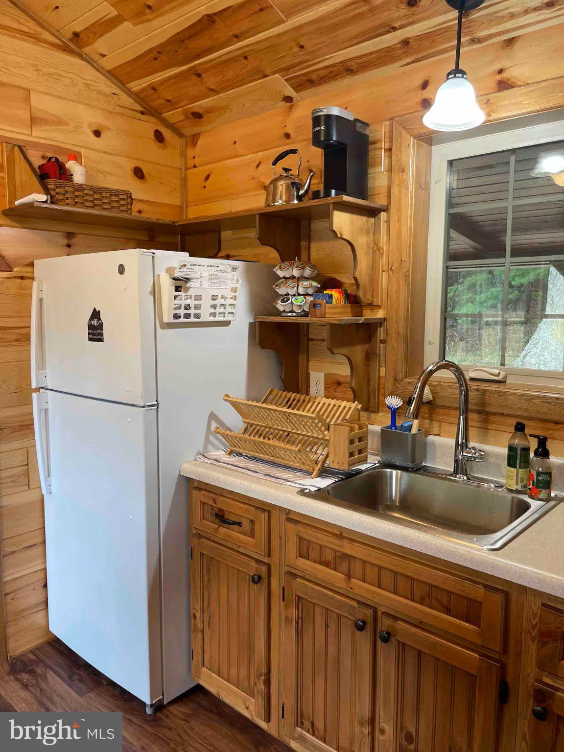 184 Skiles- Pitsenbarger Road Franklin, WV 26807 - Photo 17 of 39 Cozy cabin kitchen with rustic charm.