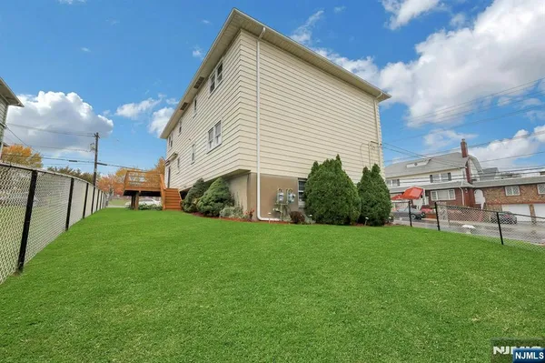 a view of a backyard of the house