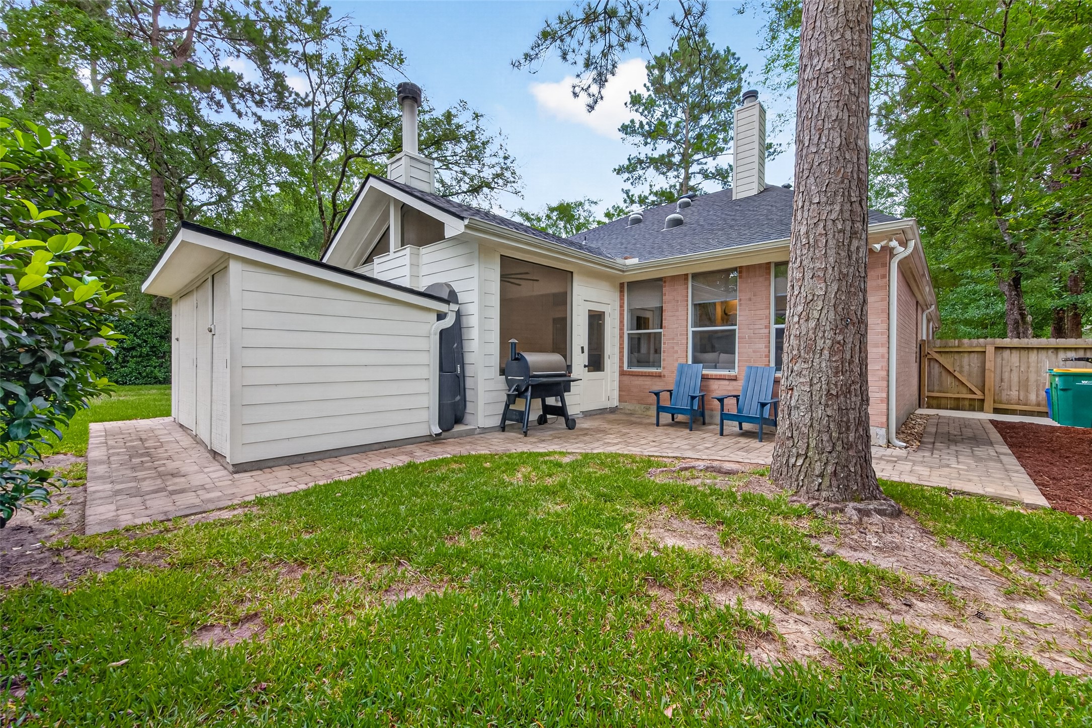 10 Belcarra Place Spring, TX 77382 - Photo 40 of 49 Backyard & Spacious Storage Building. Grass recovering a bit from the Dog.