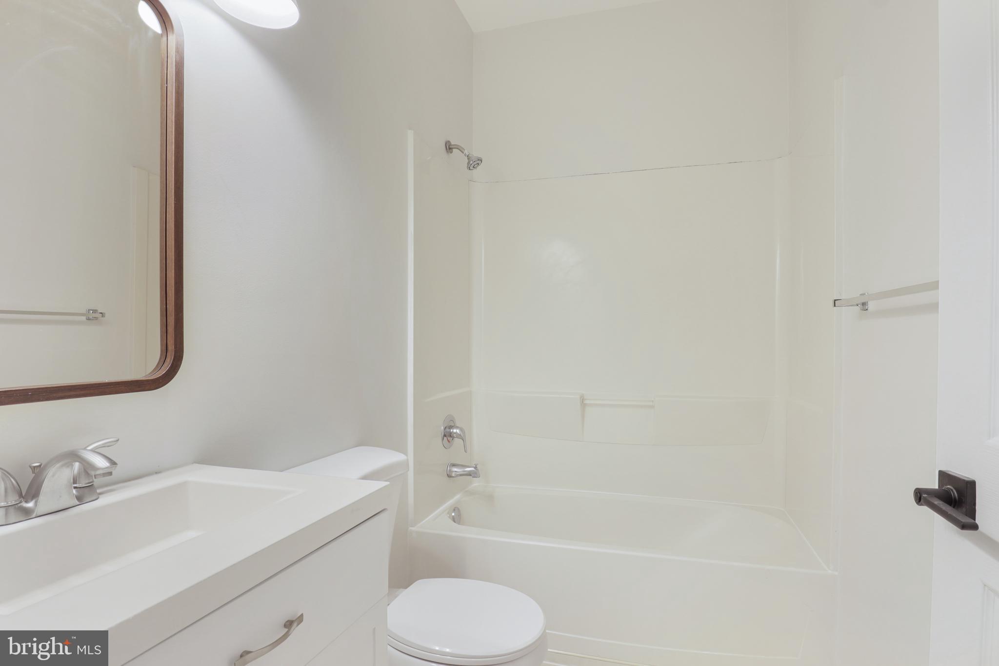 130B Remsen Avenue New Brunswick, NJ 08901 - Photo 11 of 33 a bathroom with a sink toilet and shower