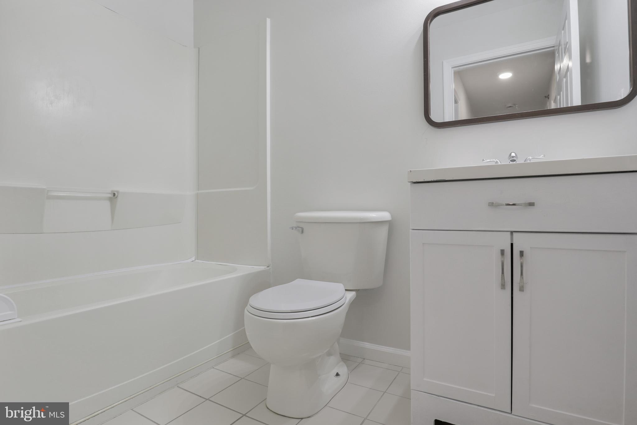 130B Remsen Avenue New Brunswick, NJ 08901 - Photo 18 of 33 a bathroom with a toilet a sink and bathtub