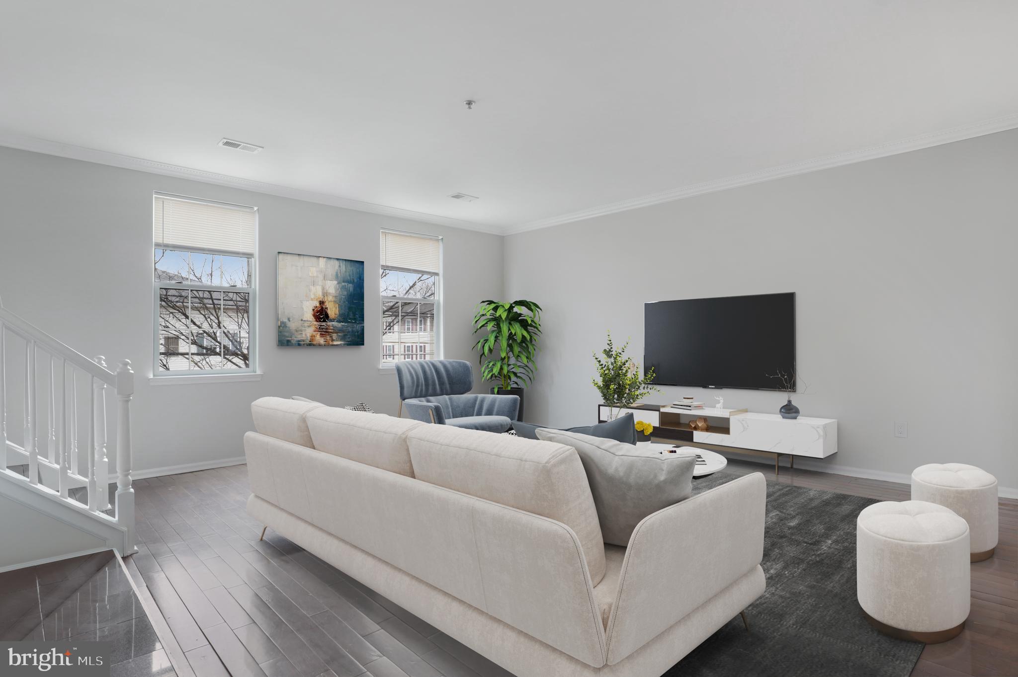 130B Remsen Avenue New Brunswick, NJ 08901 - Photo 5 of 33 a living room with furniture and a flat screen tv