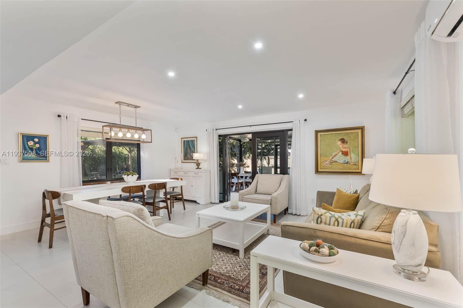7720 Southwest 59th Court South Miami, FL 33143 - Photo 11 of 34 a living room with furniture and window