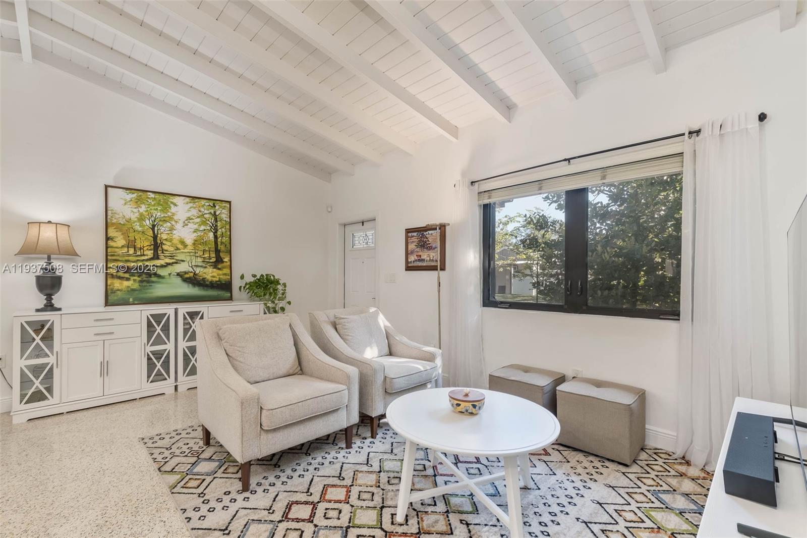 7720 Southwest 59th Court South Miami, FL 33143 - Photo 4 of 34 a living room with furniture and a window