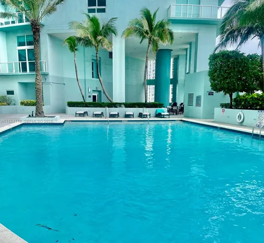 a view of a lake with houses in the back