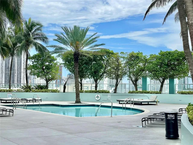 a view of a yard and palm trees