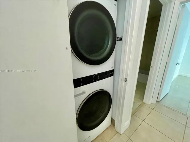 a bathroom with a sink a toilet a mirror and shower