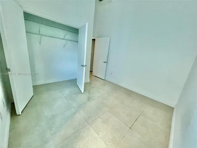 a view of a livingroom with furniture and staircase