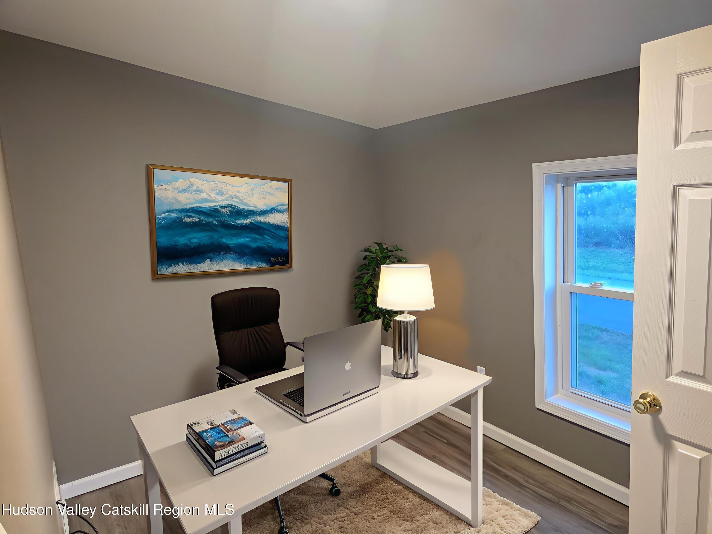 281 Bronck Mill Road Coxsackie, NY 12192 - Photo 7 of 9 a living room with furniture a lamp and a table