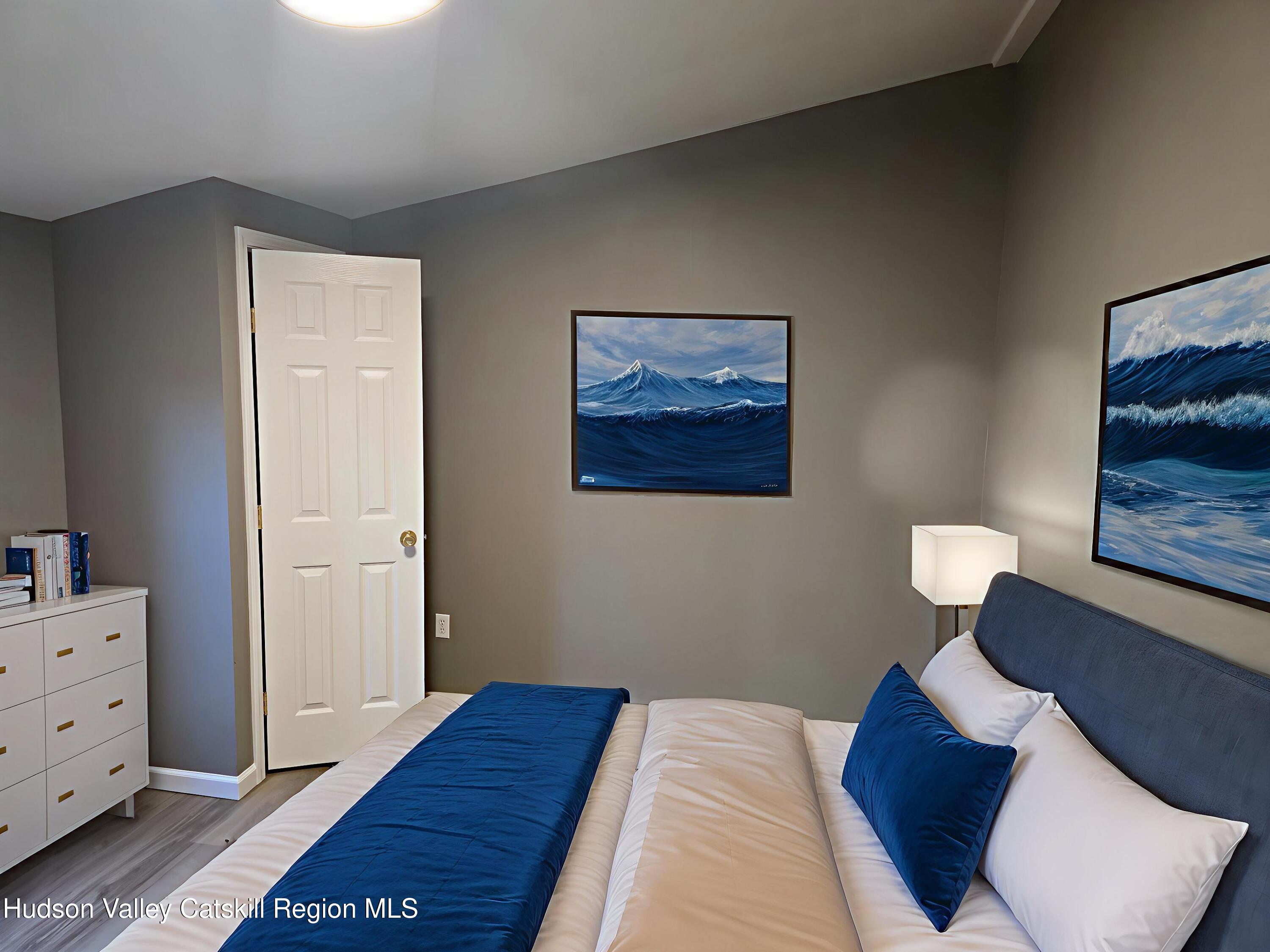 281 Bronck Mill Road Coxsackie, NY 12192 - Photo 8 of 9 a bedroom with a bed and painting on the wall