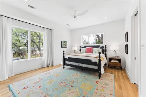a bedroom with furniture and a window