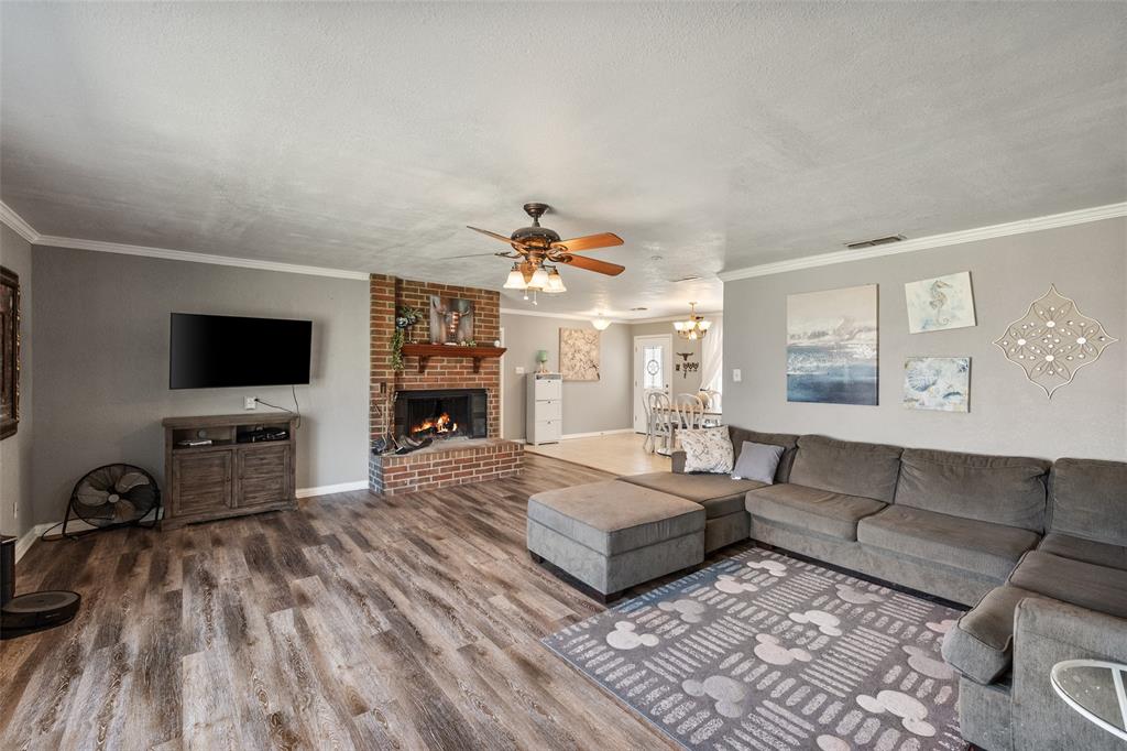 600 Bluff Springs Road Fort Worth, TX 76108 - Photo 14 of 40 a living room with furniture and a flat screen tv