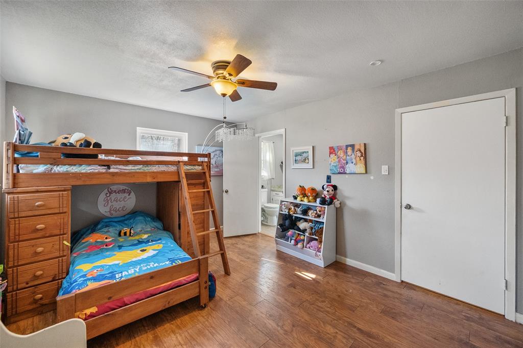 600 Bluff Springs Road Fort Worth, TX 76108 - Photo 17 of 40 a bedroom with furniture and a baby crib
